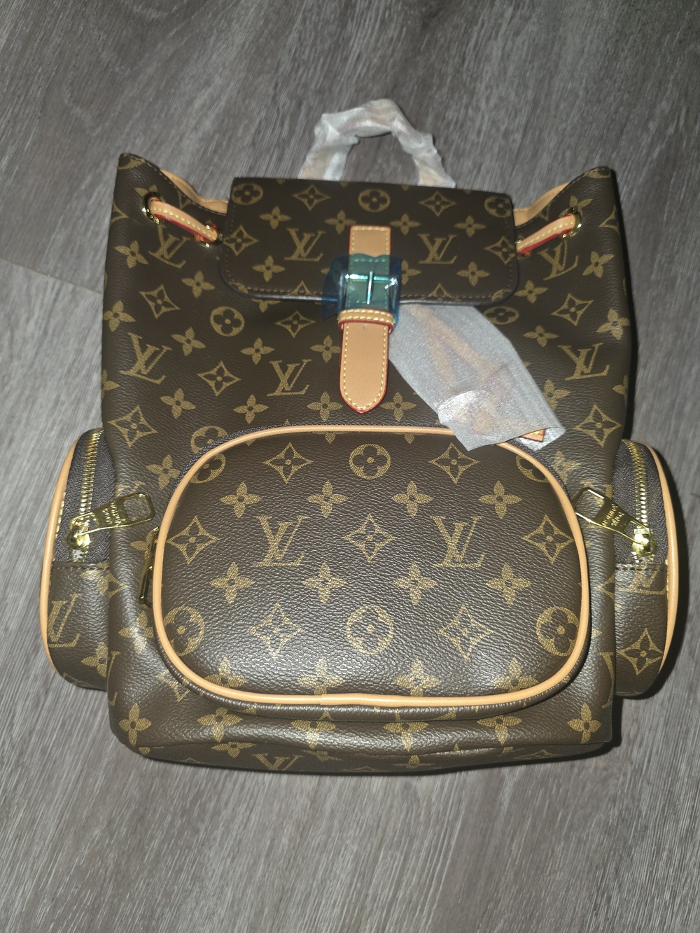 Louis Vuitton Monogram Canvas Backpack in Brown with Tan Trim